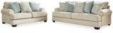 Ashley Monaghan living room set with sofa, loveseat, and armchair in neutral fabric, modern design for cozy family spaces.