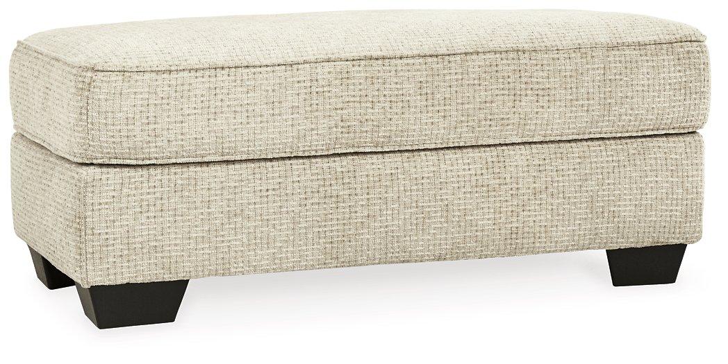 Ashley Furniture Monaghan Living Room Set with sofa and loveseat, featuring plush cushions and contemporary design.
