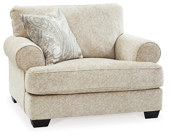 Ashley Furniture Monaghan Living Room Set with upholstered sofa and matching armchair in a modern living room setting.