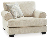 Ashley Furniture Monaghan Living Room Set with upholstered sofa and matching armchair in a modern living room setting.