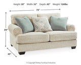Ashley Furniture Monaghan living room set with sofa and loveseat in a cozy, stylish living room arrangement.