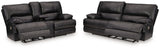 Ashley Furniture Mountainous Living Room Set featuring a cozy sofa and matching chairs in a modern design.
