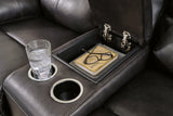 Ashley Furniture Mountainous Living Room Set featuring a sectional sofa with plush cushions and a modern design.