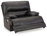 Ashley Mountainous Living Room Set featuring a sofa and armchair with plush cushions and neutral-toned fabric.