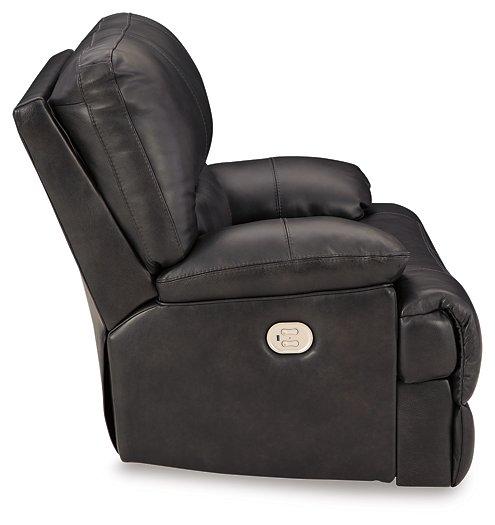 Ashley Furniture Mountainous Living Room Set featuring a sectional sofa with plush cushions and a coordinated coffee table.