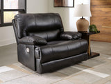 Ashley Furniture Mountainous Living Room Set featuring a sectional sofa with plush cushions and a matching coffee table.