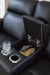 Close-up of the console detail on the Ashley Furniture 5Z-Comfort Power Reclining Living Room Set, showing plush upholstery and stitching.