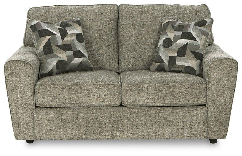 Ashley Cascilla living room set with sofa and armchair in a modern design, featuring neutral upholstery and wooden legs.