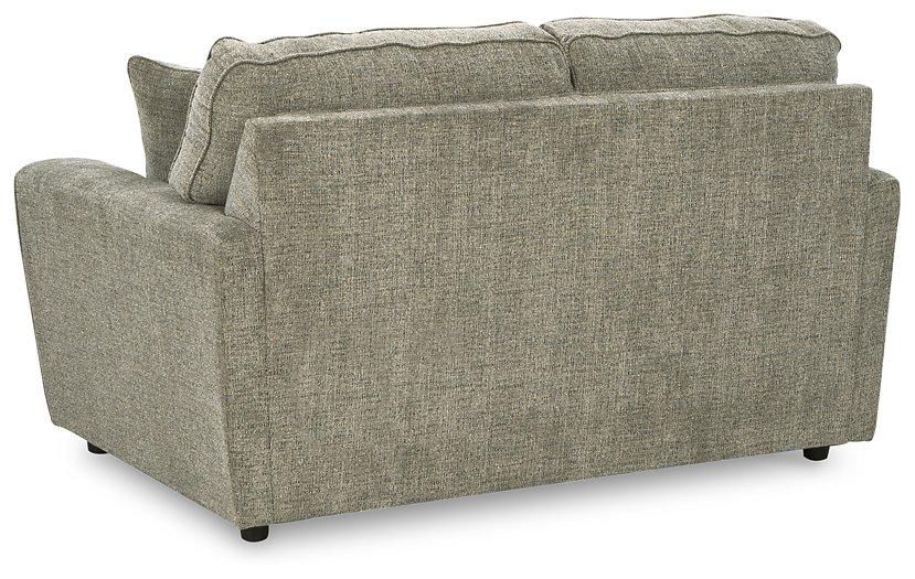 Ashley Furniture Cascilla living room set featuring a sofa, loveseat, and armchair with neutral upholstery and modern design.