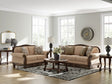 Ashley Furniture Chelsworth Living Room Set featuring a plush sofa and loveseat with neutral upholstery and modern design.