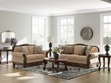 Ashley Furniture Chelsworth Living Room Set featuring a plush sofa and loveseat with neutral upholstery and modern design.