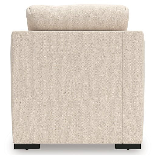 Ashley Furniture Lango living room set with sofa and armchair, featuring modern upholstery and stylish design.