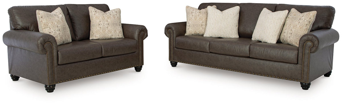 Ashley Furniture Roxmere living room set with sofa, loveseat, and armchair arranged in a stylish, modern design.