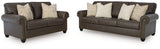 Ashley Furniture Roxmere living room set with sofa, loveseat, and armchair arranged in a stylish, modern design.