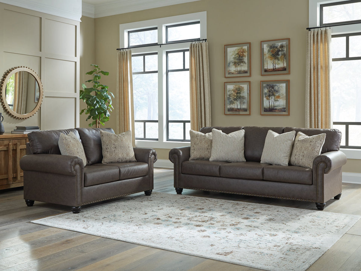 Ashley Furniture Roxmere living room set featuring a sofa and loveseat with neutral upholstery and modern design.