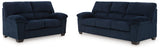 Ashley Furniture SimpleJoy living room set with a sofa and armchair, featuring neutral upholstery and modern design.