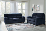 Ashley Furniture SimpleJoy living room set with sofa and loveseat in a modern design, featuring neutral upholstery and plush cushions.