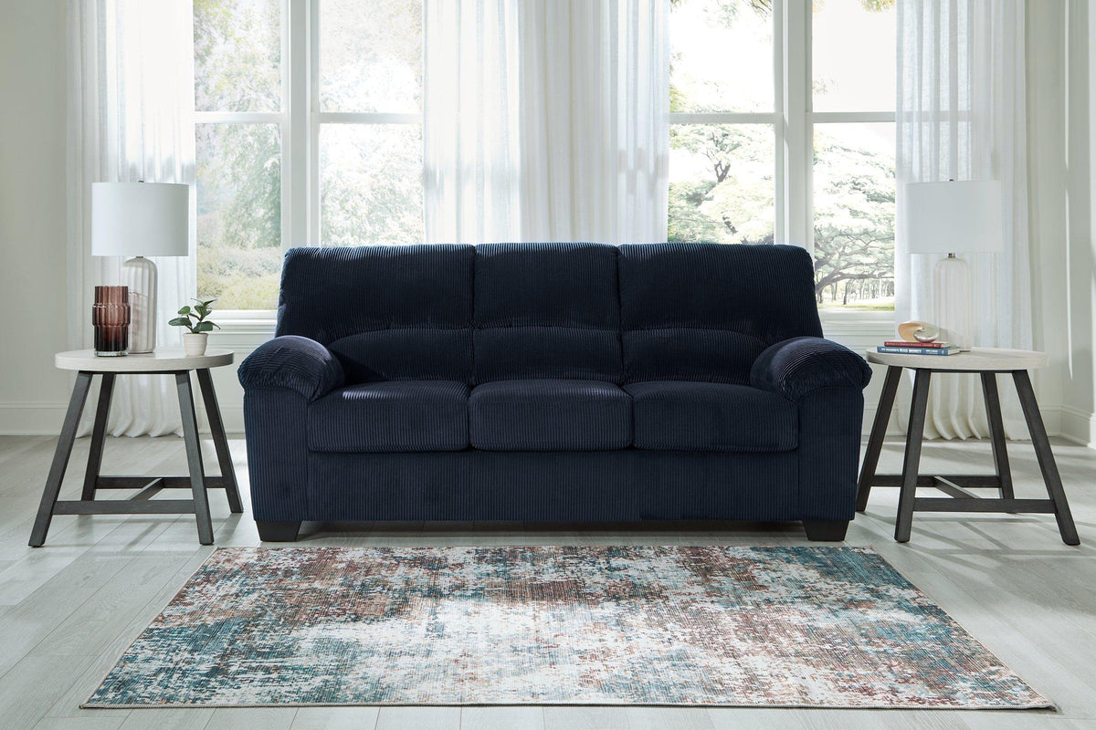 Ashley Furniture SimpleJoy living room set with a sofa and loveseat, featuring neutral upholstery and modern design.