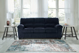 Ashley Furniture SimpleJoy living room set with a sofa and loveseat, featuring neutral upholstery and modern design.