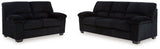 Ashley Furniture SimpleJoy living room set with a sofa and armchair, featuring neutral upholstery and modern design.
