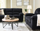 Ashley Furniture SimpleJoy living room set with sofa and loveseat in a modern design, featuring neutral upholstery and wooden legs.