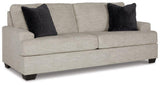 Ashley Furniture Vayda living room set with plush sofa and matching armchair in a modern design, shown in a stylish living space.