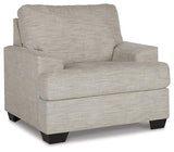 Ashley Furniture Vayda Living Room Set featuring a sofa and armchairs with neutral upholstery and modern design.