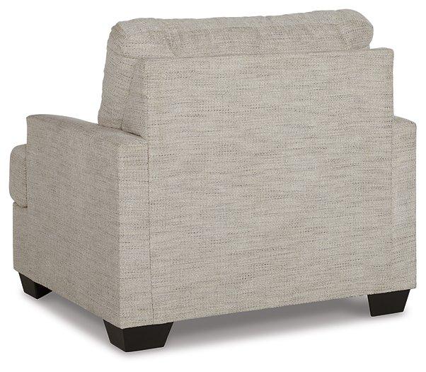 Ashley Furniture Vayda living room set featuring a sofa, loveseat, and armchair with neutral upholstery and modern design.