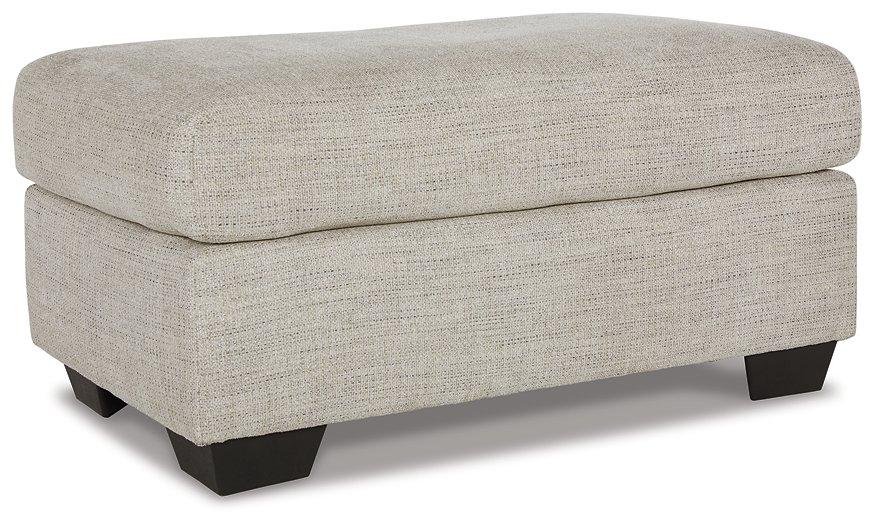 Ashley Furniture Vayda living room set with a sofa and armchair, featuring neutral upholstery and modern design.