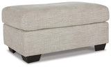 Ashley Furniture Vayda living room set with a sofa and armchair, featuring neutral upholstery and modern design.