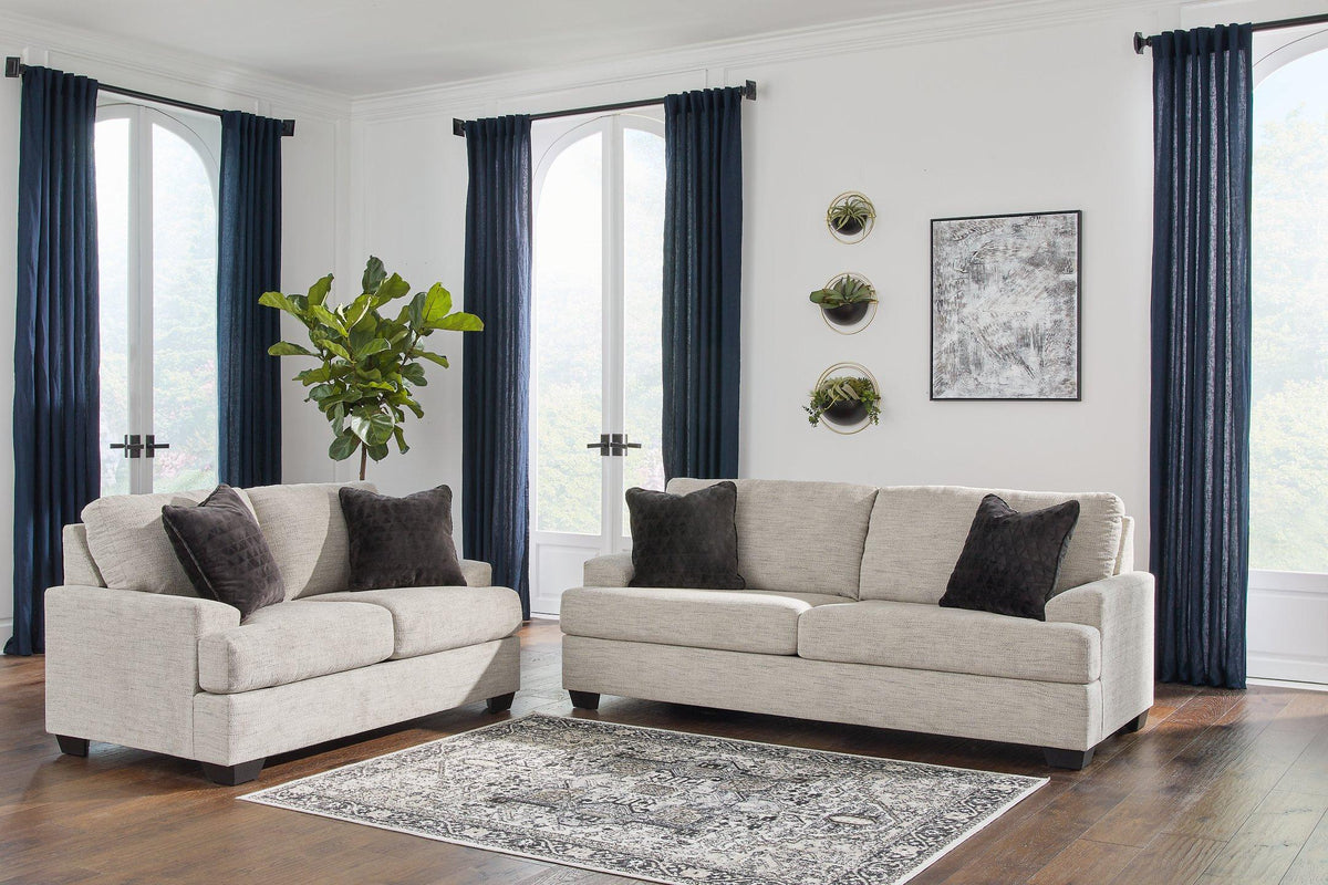 Ashley Vayda living room set featuring a sofa and loveseat with plush cushions and contemporary design in a stylish living space.