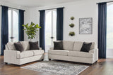 Ashley Vayda living room set featuring a sofa and loveseat with plush cushions and contemporary design in a stylish living space.