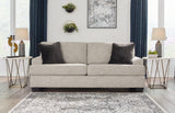 Ashley Vayda Living Room Set with sofa and armchair in neutral fabric, modern design, and plush cushions.