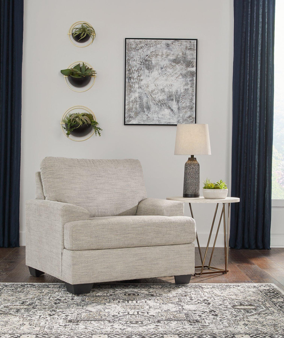 Ashley Furniture Vayda living room set with sofa and armchair, featuring neutral upholstery and modern design for stylish living spaces.