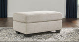 Ashley Furniture Vayda living room set with a sofa and armchair, featuring neutral upholstery and wood legs.