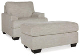 Ashley Furniture Vayda living room set featuring a sofa and loveseat with neutral upholstery and modern design.