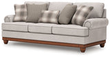 Ashley Furniture Clearbrooke living room set featuring a sofa and armchair with neutral upholstery and modern design.