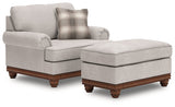 Ashley Furniture Clearbrooke living room set featuring a sofa, loveseat, and armchair with neutral fabric and wooden accents.