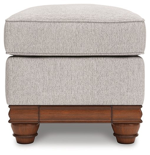 Ashley Furniture Clearbrooke living room set featuring a sofa and loveseat with neutral fabric and wooden legs.