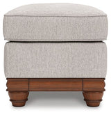 Ashley Furniture Clearbrooke living room set featuring a sofa and loveseat with neutral fabric and wooden legs.