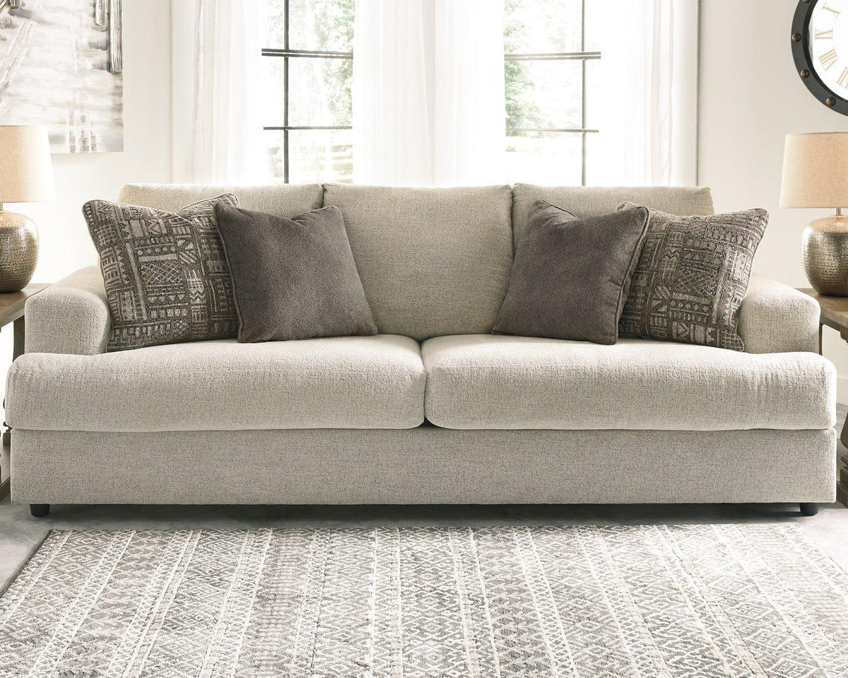 Ashley Furniture Soletren living room set featuring a sofa, armchair, and coffee table with modern design and neutral upholstery.
