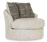 Ashley Furniture Soletren living room set with sofa and armchair, featuring neutral upholstery and modern design.