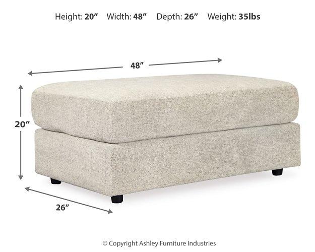 Ashley Furniture Soletren living room set featuring a sofa and matching armchair with neutral upholstery and modern design.