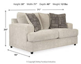Ashley Furniture Soletren Living Room Set with sofa and armchair featuring neutral upholstery and modern design in a cozy living space.
