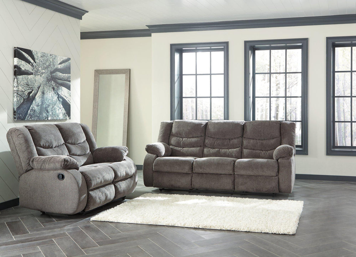 Ashley Furniture Tulen living room set with sofa and armchairs in a modern design, shown in a stylish, well-lit home interior.