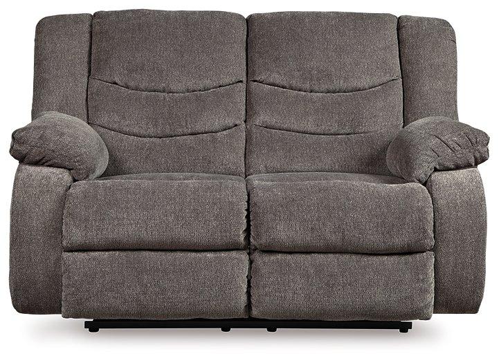 Ashley Tulen Living Room Set featuring a sofa and armchair with neutral fabric and wooden legs in a modern living space.