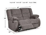 Ashley Furniture Tulen living room set with plush sofa and matching armchair in a modern design, shown in a stylish living space.