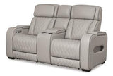 Ashley Furniture Boyington power reclining loveseat with built-in console, featuring plush cushions and dark upholstery.