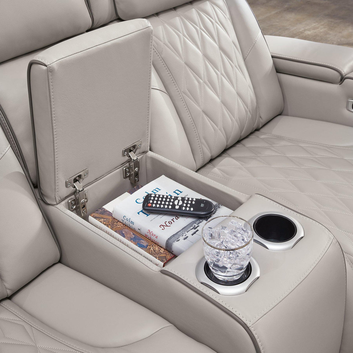 Ashley Boyington Power Reclining Loveseat with Console featuring plush upholstery, built-in cup holders, and ergonomic design.