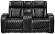 Ashley Furniture Boyington power reclining loveseat with console, featuring plush upholstery and built-in cup holders for comfort.